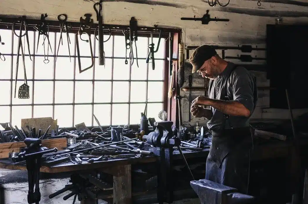 An expert crasftmen works in his shed